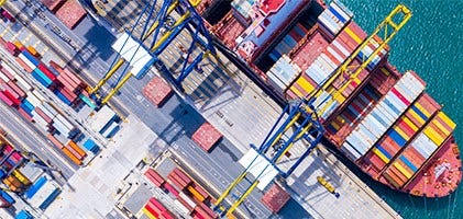 Aerial view of a container port Description automatically generated