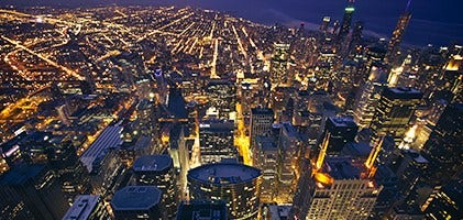 Aerial view of Chicago full of city lights at nighttime